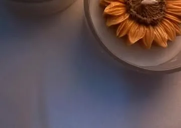 Close-up of a sunflower wax candle